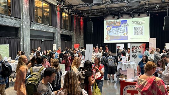 photo of a large room fillde with people