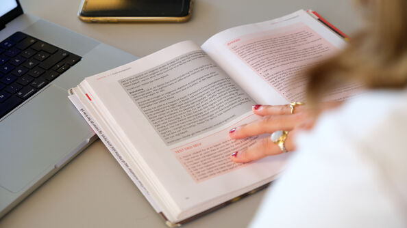 open textbook with Norwegian