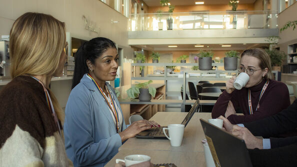 People sitting around a table at the kantine